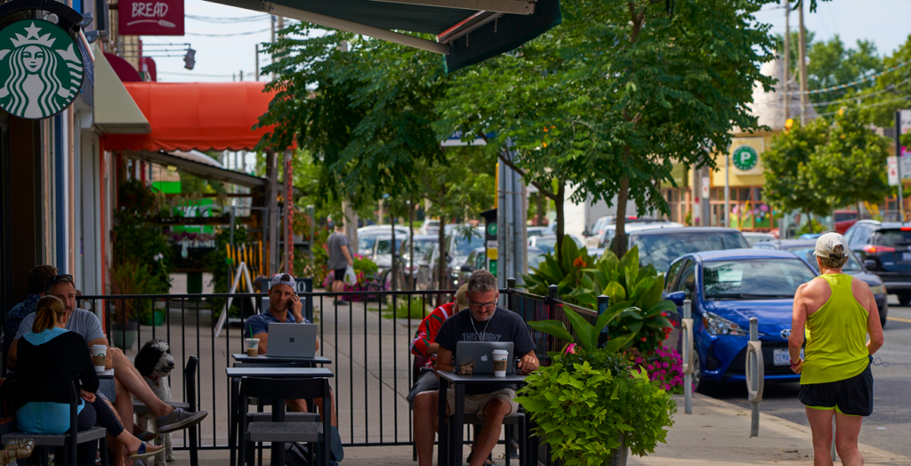 Professional remote workers enjoying outdoor seating in the transit-rich and walkable district of Midtown Toronto.